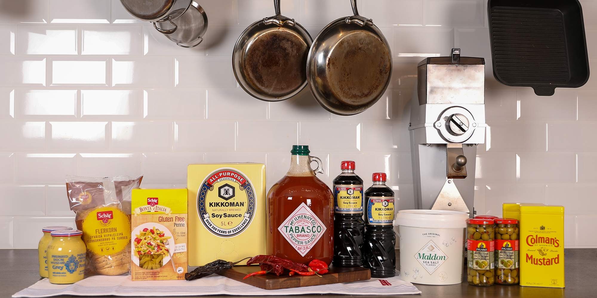 Cook decorating a plate and putting the ultimate touches - focus on foreground